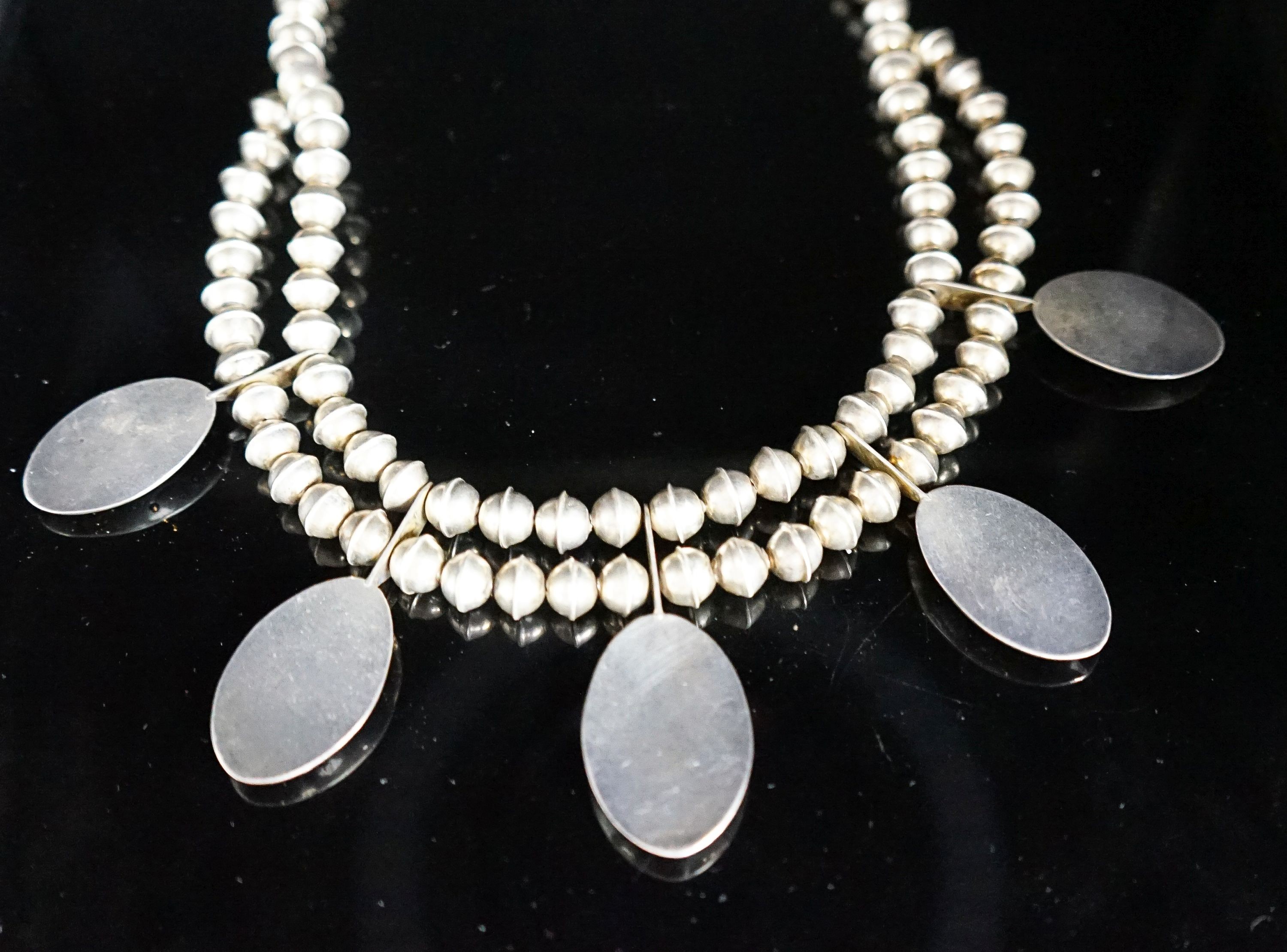 A 20th century South American? white metal and turquoise set drop necklace, approx. 44cm, gross weight 52 grams.